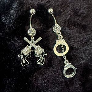Brand new dangle belly button jewelry! Hand cuff and guns